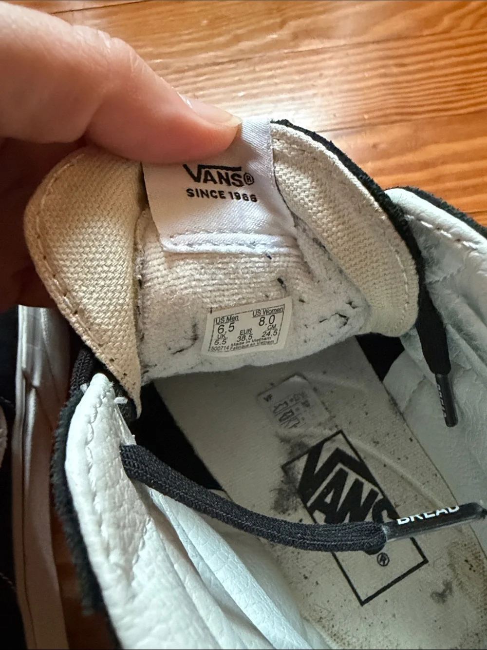 Vans Black and White High-Top Skate Sneakers